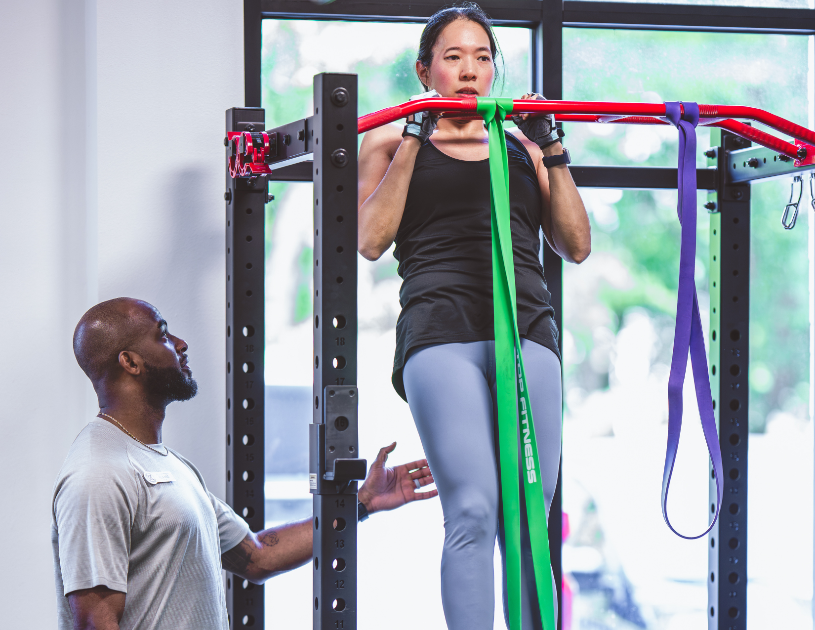 trainer coaching a patient on core exercise.